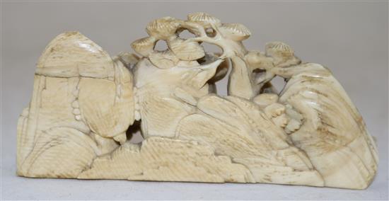 A Chinese ivory figural brush rest, 18th century, length 9.7cm